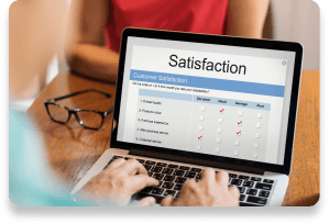 Hands typing on laptop showing customer satisfaction survey